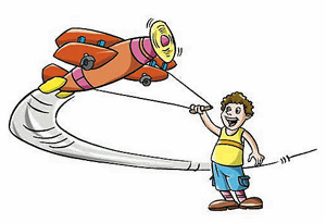 A boy is circling his model aircraft.