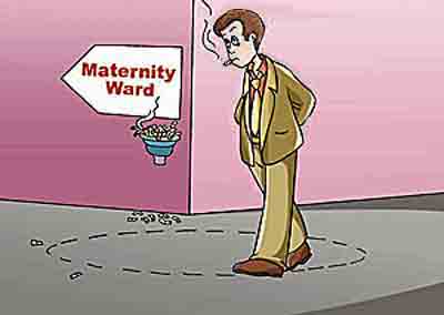 A man is walking around nervously at the hospital.